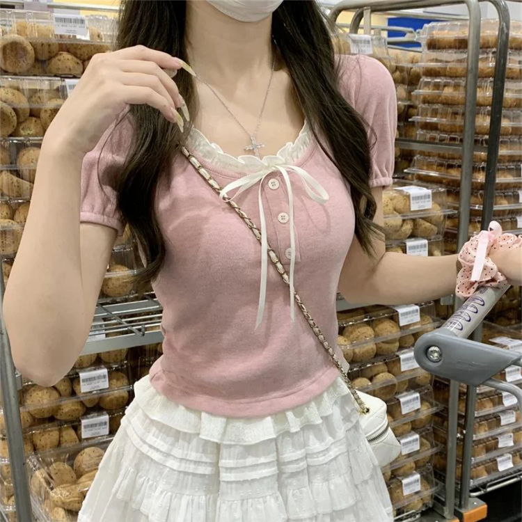 Pink Ribbon Knit Ballet Top with fine ribbed knit texture, short puff sleeves, and decorative ribbon tie at neckline