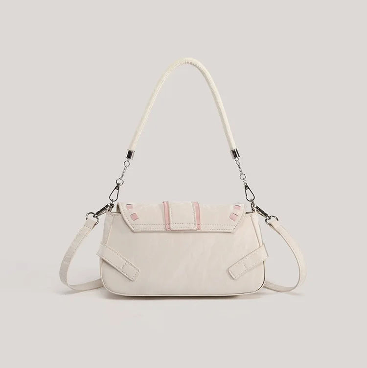 Back view of the cream Ribbon Romance Shoulder Bag, showcasing the soft velvety finish and detachable shoulder strap.