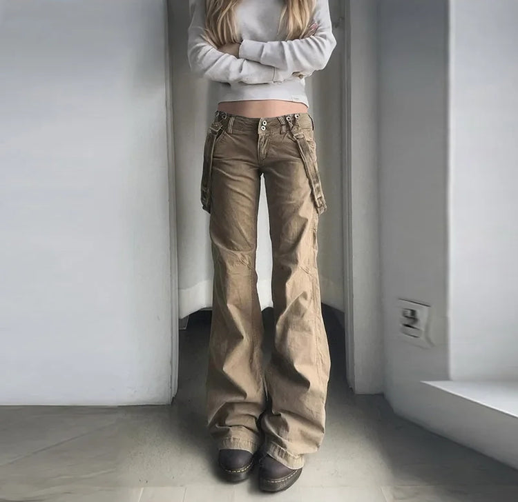 Model wearing Rogue Revival Utility Pants with a light gray sweatshirt and chunky brown shoes