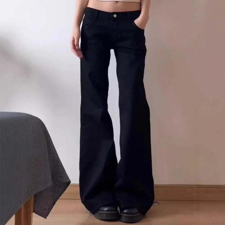Model wearing the Rogue Rise Rigid Flare Jeans.