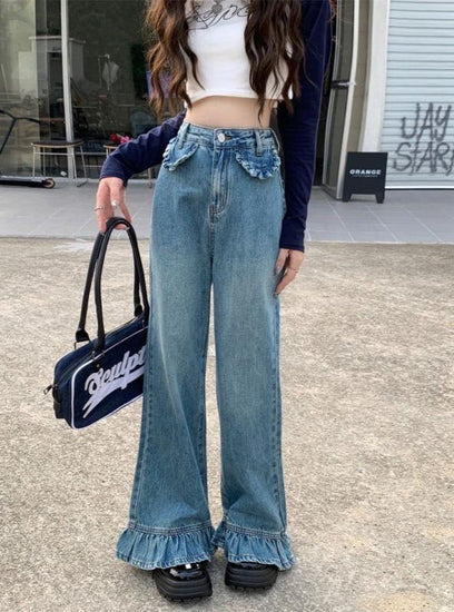 Model standing Ruffle Flare Wide Leg Jeans, showing ruffle hems and high-waisted fit