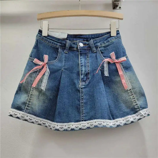 Dark denim Southern Charm Mini Skort featuring pocket bows in red gingham and white lace, with lace-trimmed hem