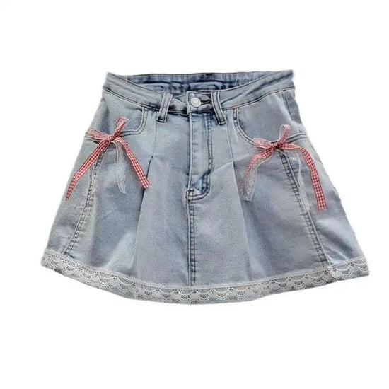 Flat lay of Southern Charm Mini Skort in light denim with gingham and lace bows and scalloped lace hem