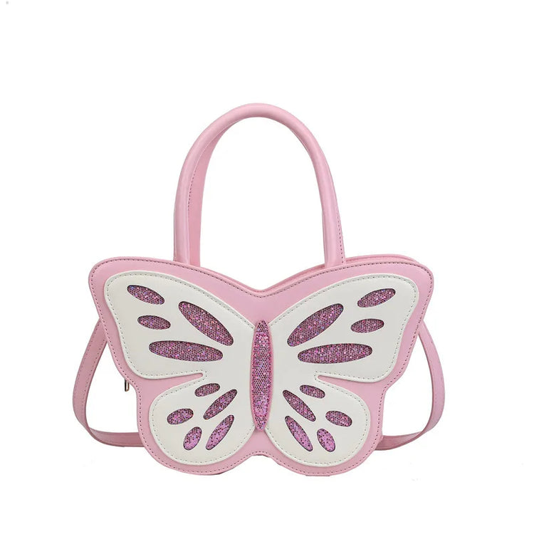 Flat lay of Sparkling Butterfly Handbag in pink and white with glitter finish and top handles