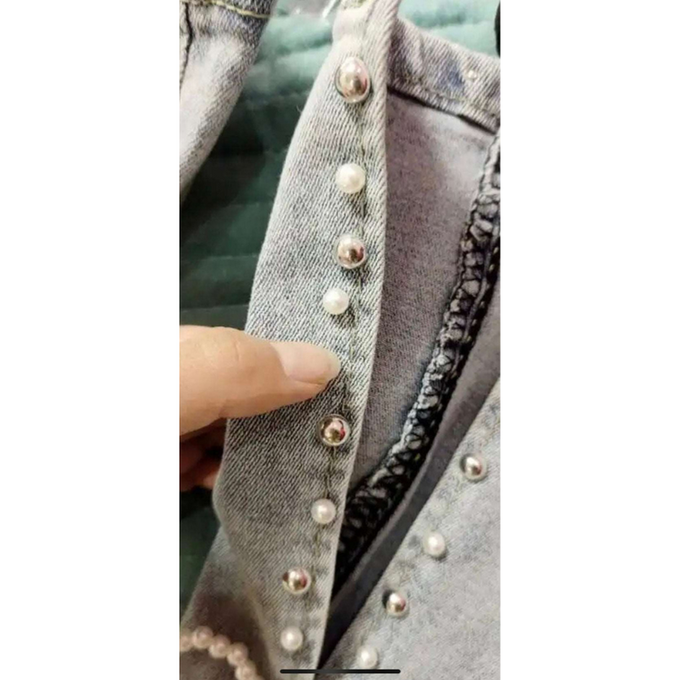 Detailed close-up of pearl and stud beading at the bottom of the slit on the Split Statement Pearl Jeans