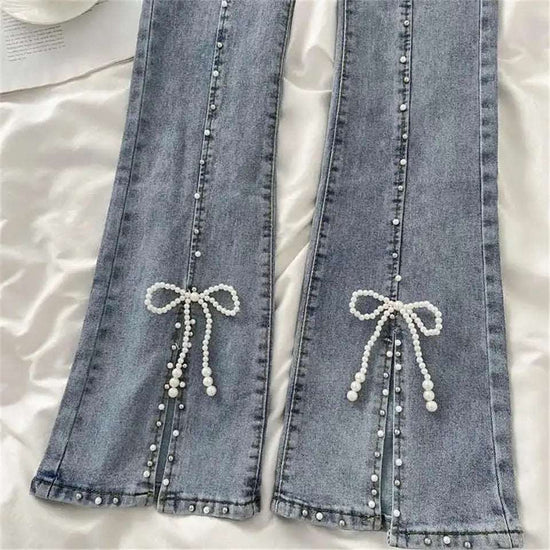 Close-up of pearl beading and bow at the slit of Split Statement Pearl Jeans