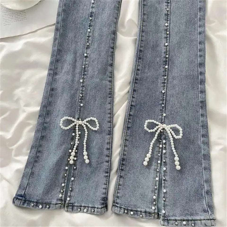 Close-up of pearl beading and bow at the slit of Split Statement Pearl Jeans