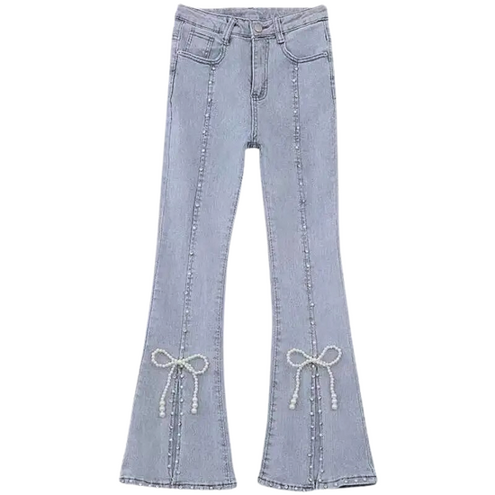 Flat lay of Split Statement Pearl Jeans with calf-high slits and pearl bow details