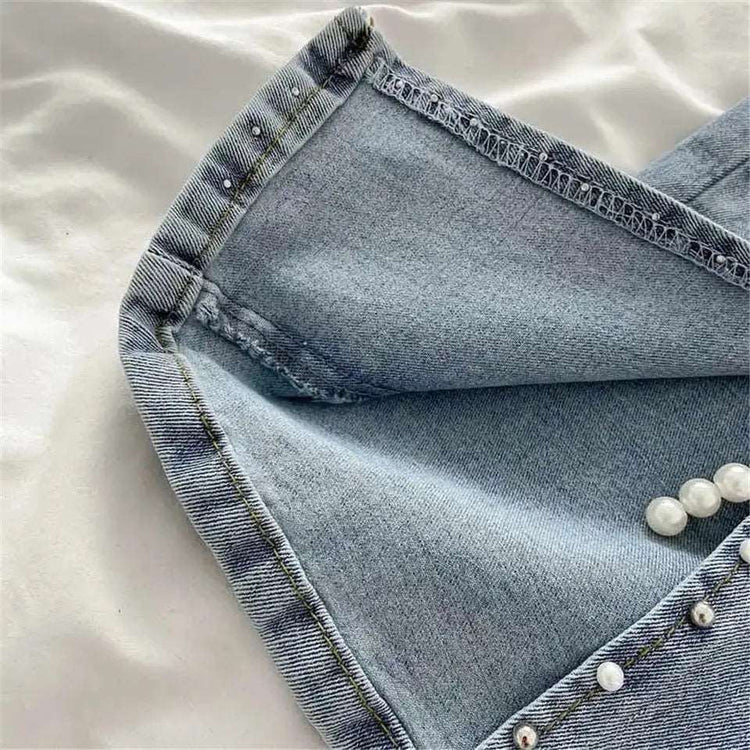 Close-up of pearl and stud beading at the slit of Split Statement Pearl Jeans