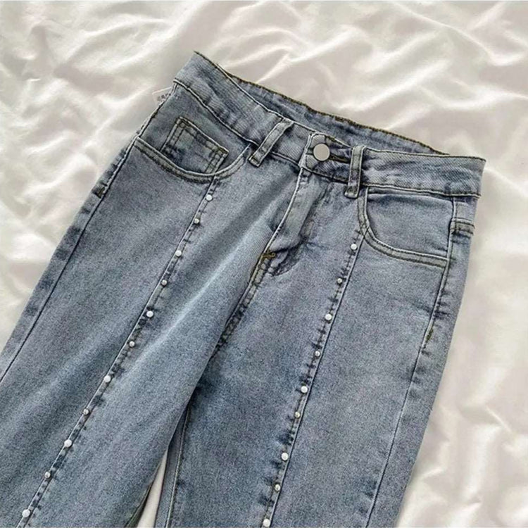 Close-up of top of Split Statement Pearl Jeans showcasing pearl and stud detailing