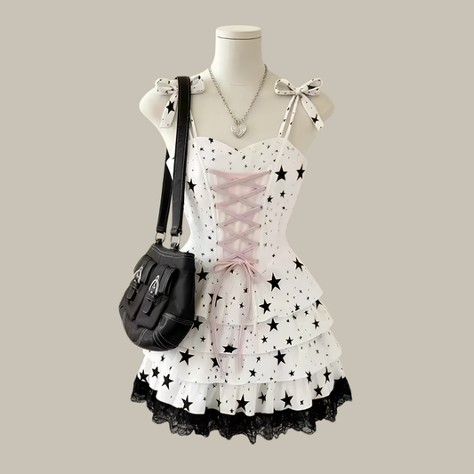 Starry-Eyed Fantasy Dress mini dress with black stars and pink lace-up detail