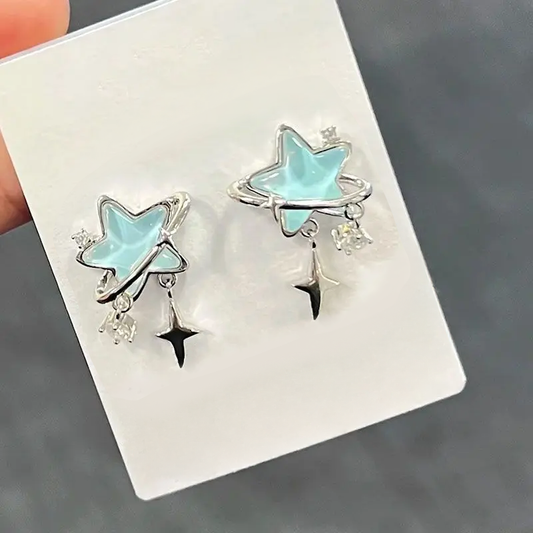 Starstruck Orbit Earrings with iridescent blue star charm, silver orbit ring, and crystal dangle