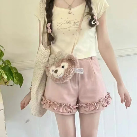 Front view of light pink Sugar Swirl Ruffle Shorts with ruffle hem