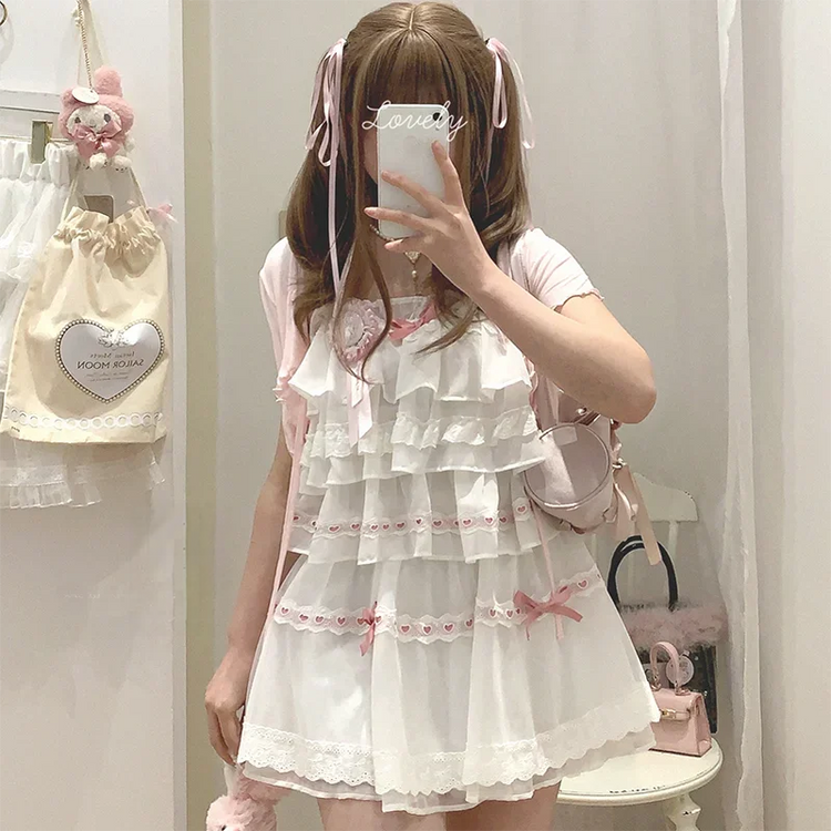 Model wearing the white and pink Sweet Love Lace Bow Skort styled with a matching top.