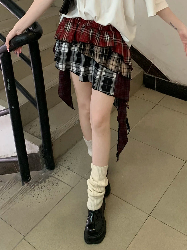 Angled view of model in the Tilted Temper Tartan Skirt, showing movement of the layers