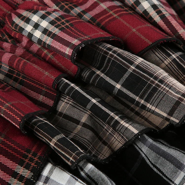 Detail shot of the waistband and layered hems of the Tilted Temper Tartan Skirt