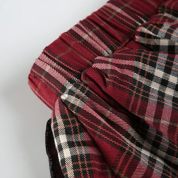 Detail shot of the side of the waistband of the Tilted Temper Tartan Skirt
