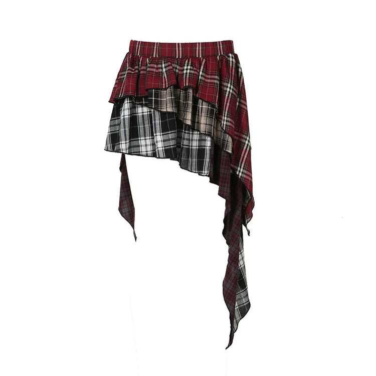 Flat lay of the Tilted Temper Tartan Skirt showcasing mismatched plaid panels and angled hem
