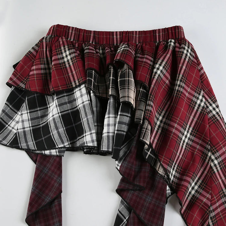 Detail shot of the front of the Tilted Temper Tartan Skirt. showing the details of the waistband and hem