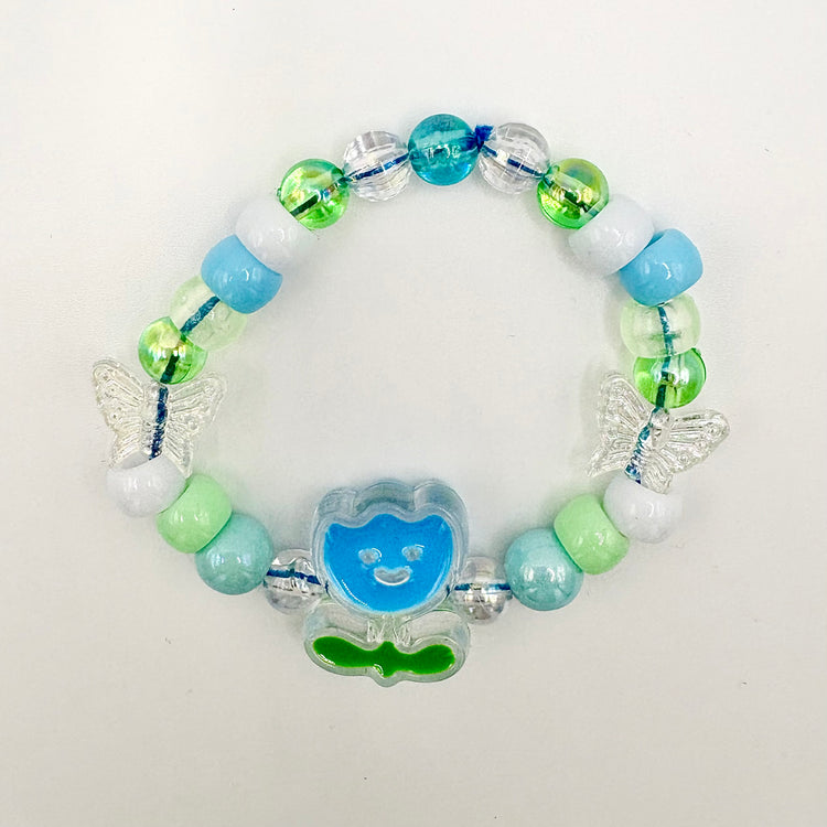 Another view of the Two Moody Originals: Kandi Bracelet in Bluebell Bloom, with a clearer view on the flower charm