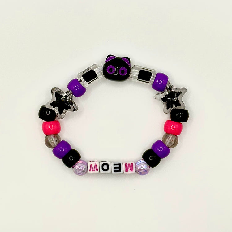 Another view of the Two Moody Originals: Kandi Bracelet in Moonlit Meow, with the cat charm rightside up