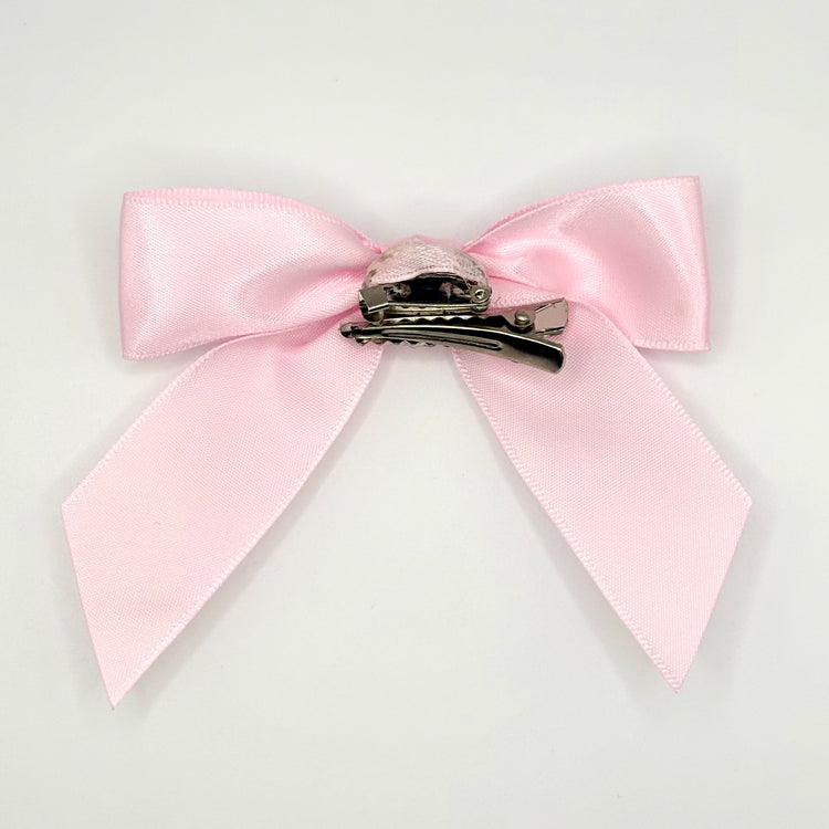 Back of the large classic Two Moody Originals: Signature Bow Clips in the color light pink, showcasing the alligator hair clip and brooch pin