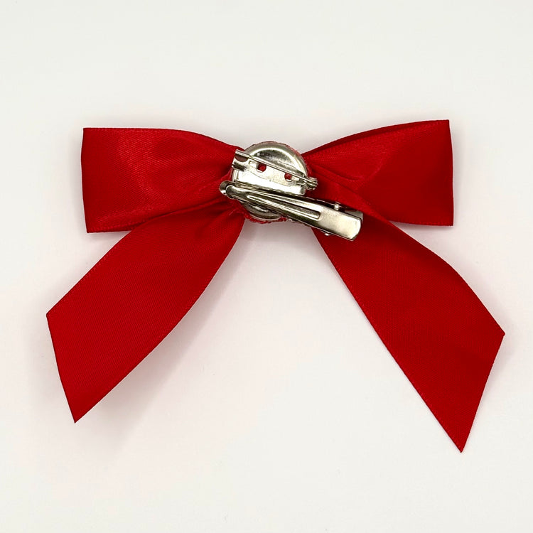 Back of the large decorated Two Moody Originals: Signature Bow Clips in the color red, showcasing the alligator hair clip and brooch pin