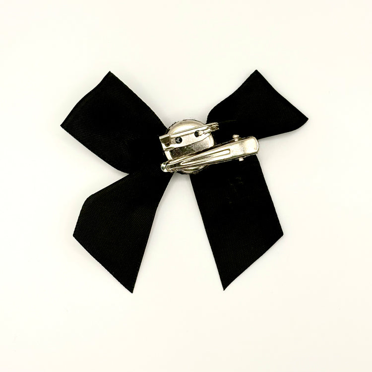 Back of the small classic Two Moody Originals: Signature Bow Clips in the color black, showcasing the alligator hair clip and brooch pin