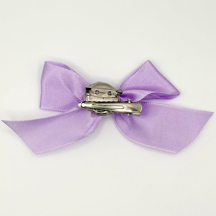 Back of the small classic Two Moody Originals: Signature Bow Clips in the color lavender, showcasing the alligator hair clip and brooch pin
