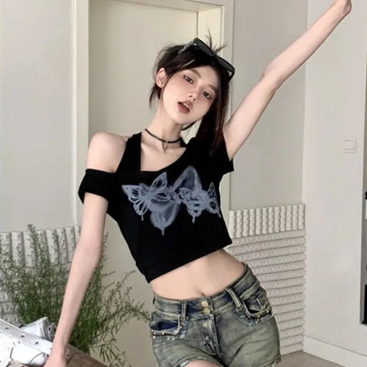 Model posing with one arm up wearing Whispering Wings Open Shoulder Top with graffiti-style butterfly print, front view