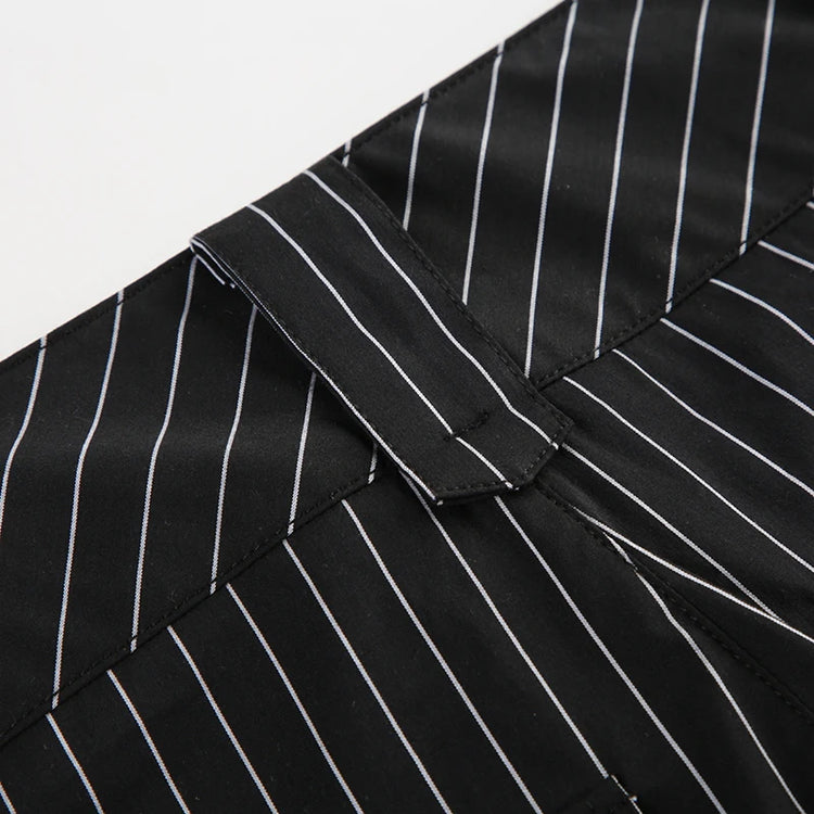 Close-up of Y2K Business Chic Trousers belt loop on black pinstriped fabric