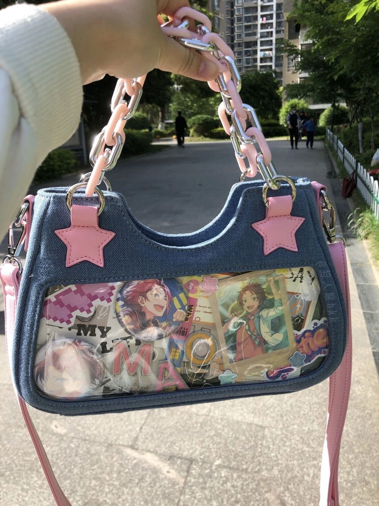 Back view of the Y2K Harajuku Star Denim Chain Bag in light blue with a large clear display pocket holding decorative cards and images.