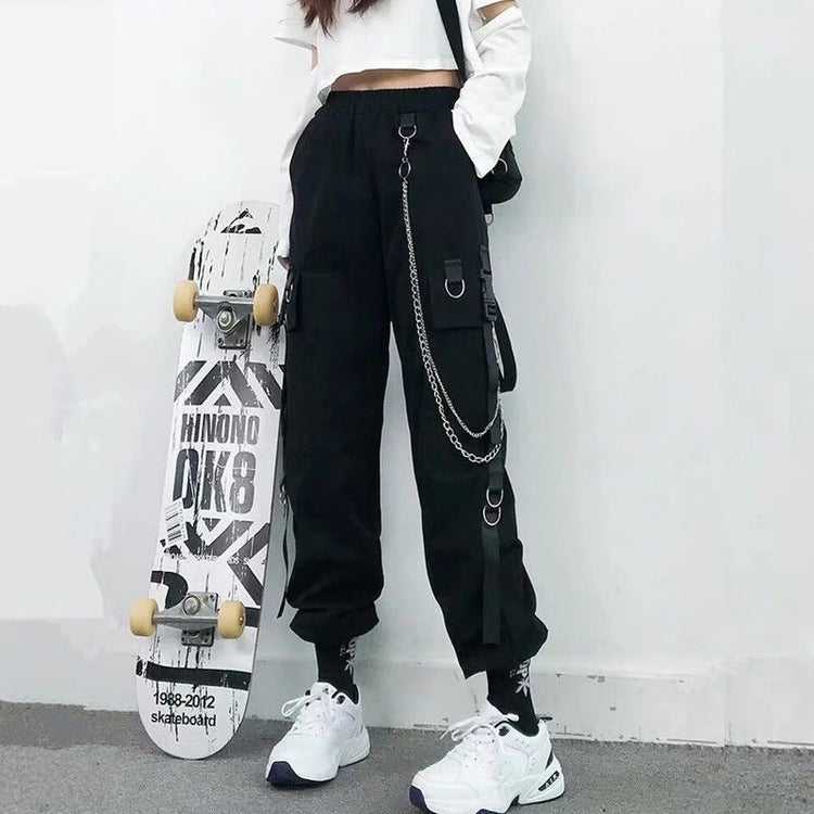 Front view of model wearing black Chain Reaction Cargo Joggers showing flap pocket and hanging chain
