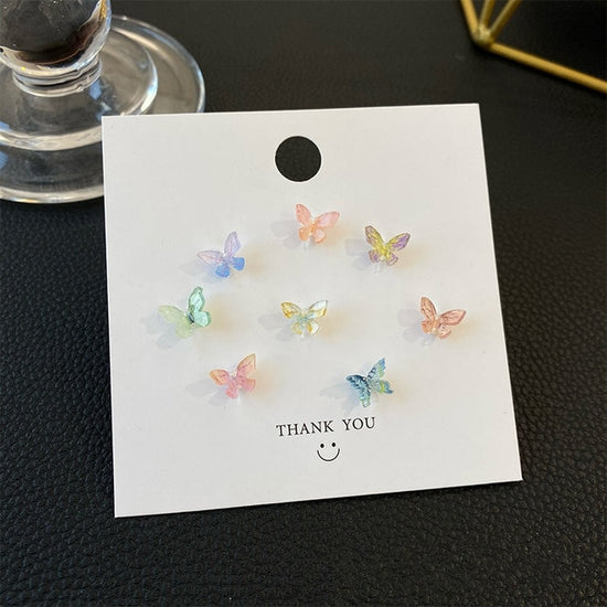 Multicolor set of Dreamlit Butterfly Stud Earrings displayed on a thank-you card.