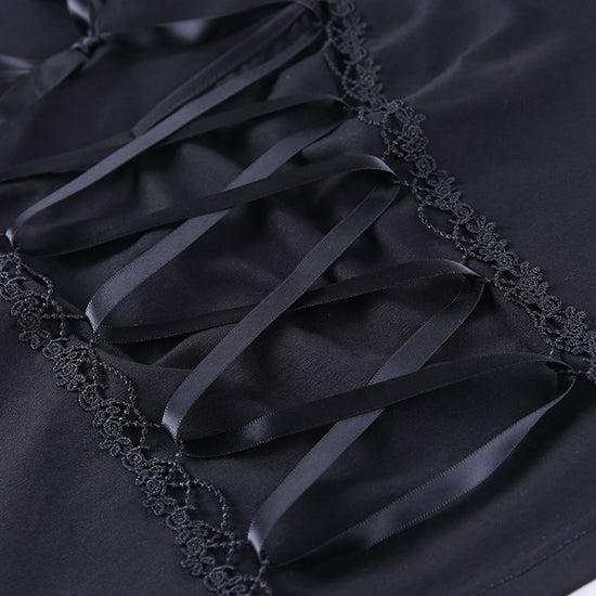 Detail shot of satin lace-up ribbon at the front of Petal Noir Lace-Up Top
