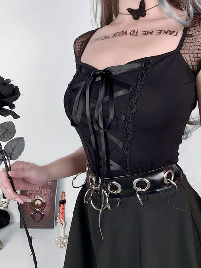 Model shown in a three-quarter angle wearing the Petal Noir Top with mesh sleeves visible