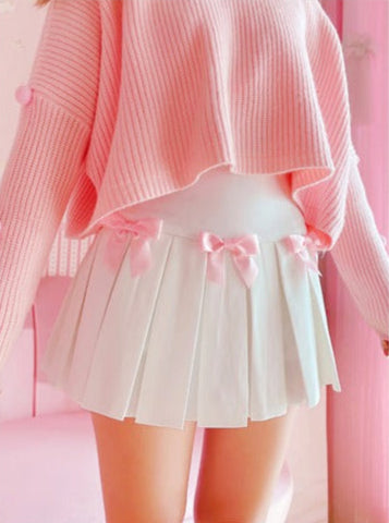 Angled side view of the Sweetheart Academy Skort showing the flared pleats and pink bows