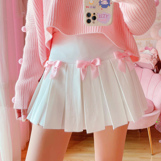 Front view of the Sweetheart Academy Skort, showcasing pink bows on waistline
