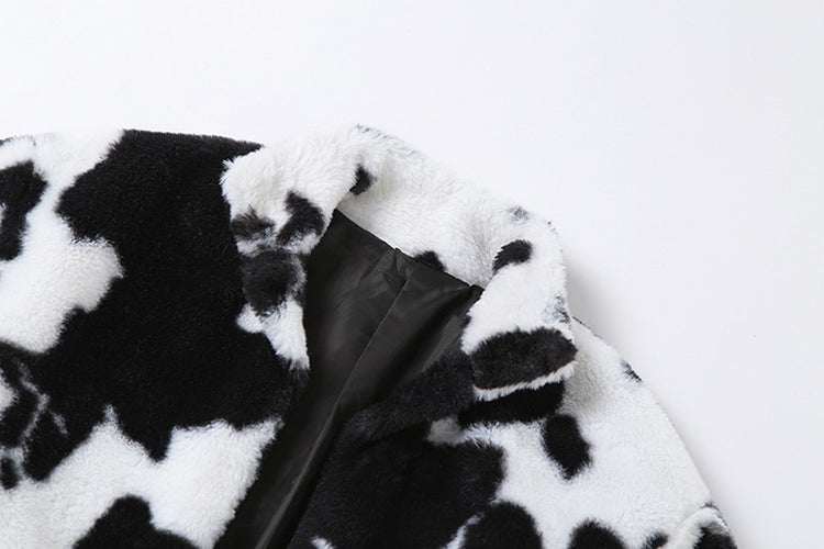 Close-up of faux fur collar and cow print texture on Udderly Wild Jacket