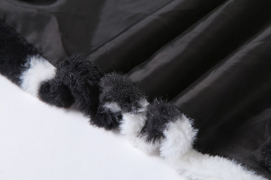 Close-up of faux fur, cow print texture, and jacket lining on Udderly Wild Jacket