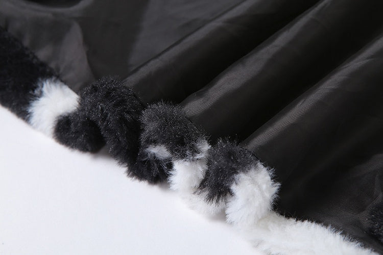 Close-up of faux fur, cow print texture, and jacket lining on Udderly Wild Jacket