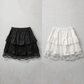 Flat lay of the Frosted Layers Ruffle Skort in black and white.