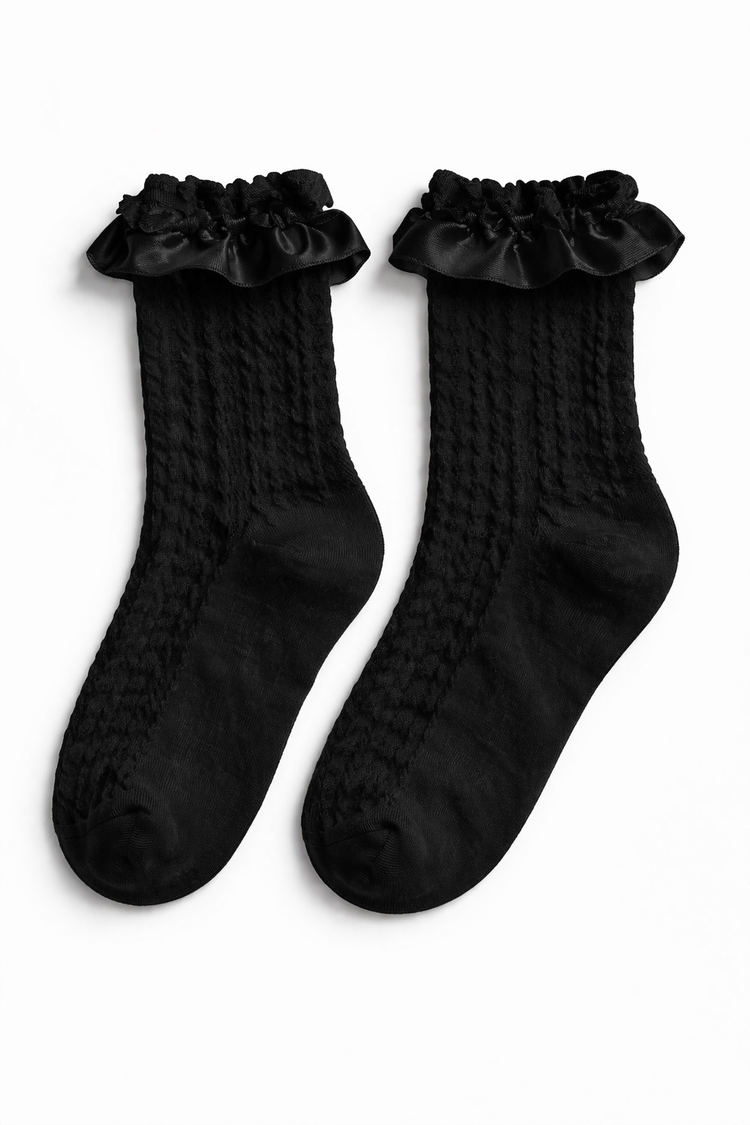 The Innocent Mischief Lace Socks in black with satin ruffle.
