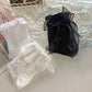 Folded view of the Innocent Mischief Lace Socks in white and black in all three styles.