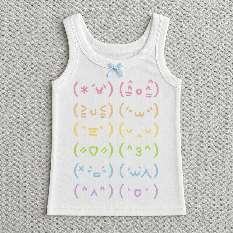 Flat lay of the Moody Kaomoji Tank on top of white carpet.
