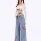 Distressed Pink Butterfly Jeans