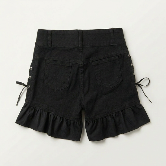 Back view of Two Moody Originals: Pretty Dangerous Shorts featuring custom ruffle hems and black denim construction.