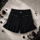Two Moody Originals: Pretty Dangerous Shorts styled with gothic-inspired accessories, featuring custom ruffle hems, skull embellishments, and studded ribbon side lacing.