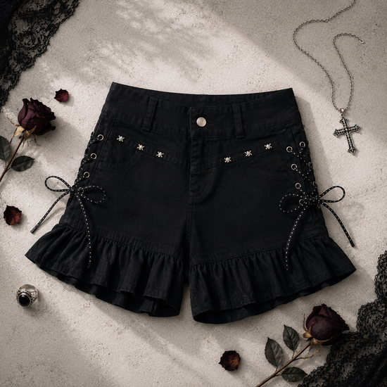 Two Moody Originals: Pretty Dangerous Shorts styled with gothic-inspired accessories, featuring custom ruffle hems, skull embellishments, and studded ribbon side lacing.