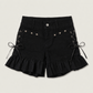 Two Moody Originals: Pretty Dangerous Shorts in black denim with custom ruffle hems, skull embellishments, and studded ribbon side lacing.